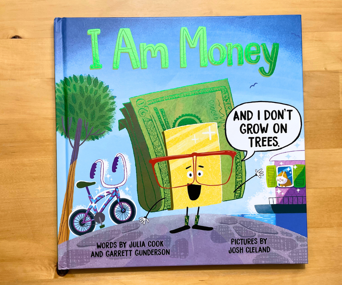 bright blue, yellow, and shiny foil green I Am Money cover with cartoon money on it