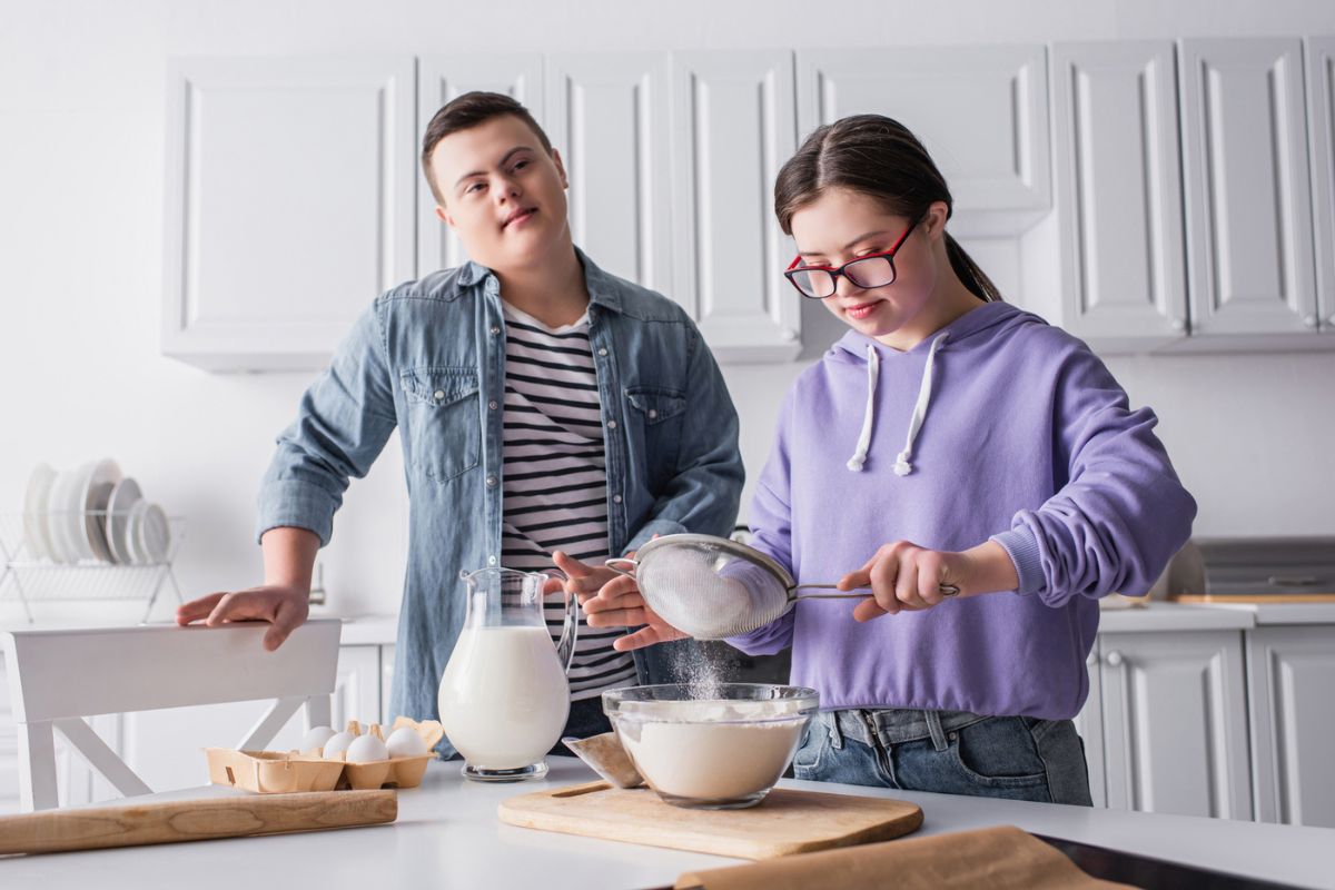 special needs teen girl baking in the kitchen