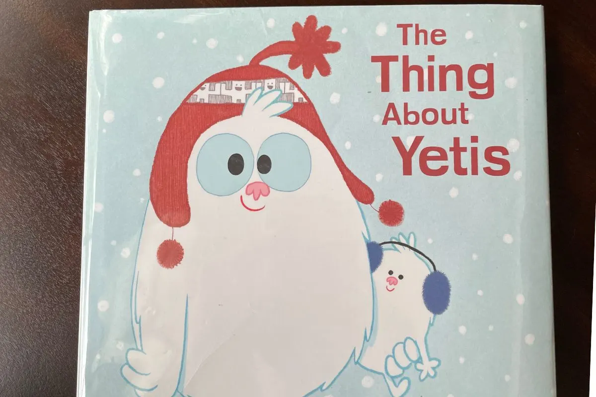 pale blue cover with two smiling yeti friends