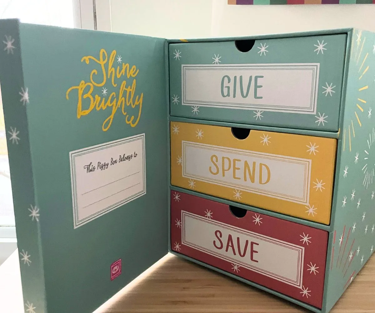 light mint, yellow, and red box opened to show three compartments for give, spend, save