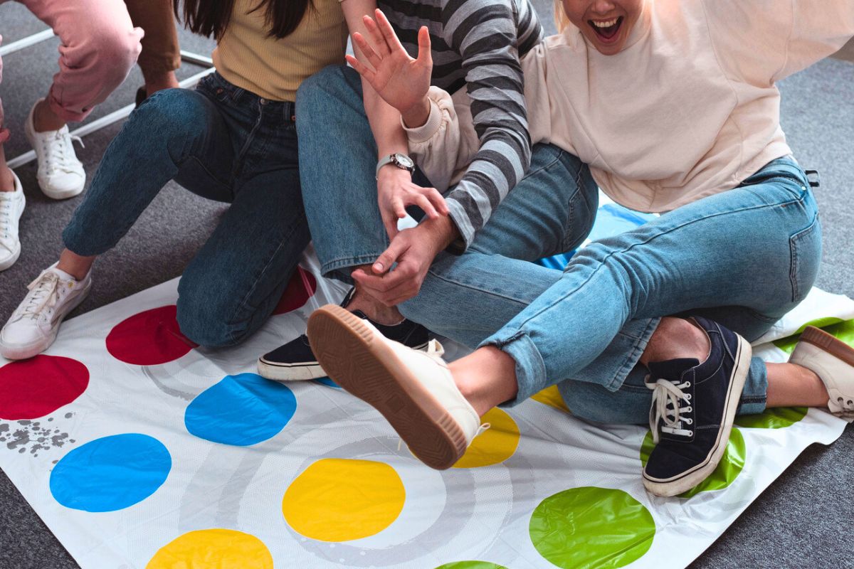 group of teens playing tag team twister