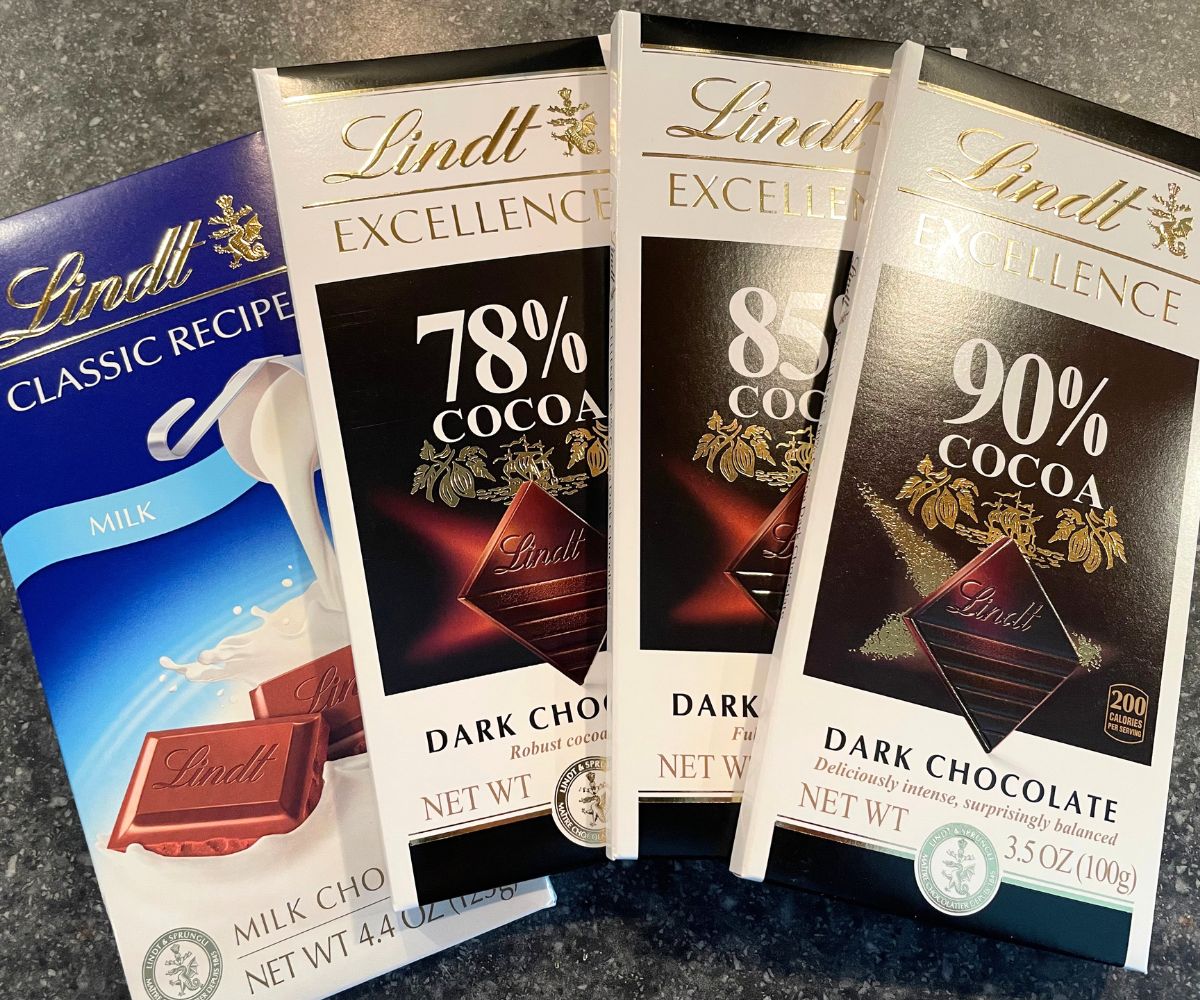 four Lindt chocolate bars ranging from milk chocolate to 90% cocoa