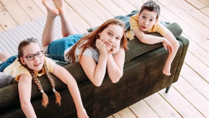 three tweens on couch looking expectantly at camera for indoor activities