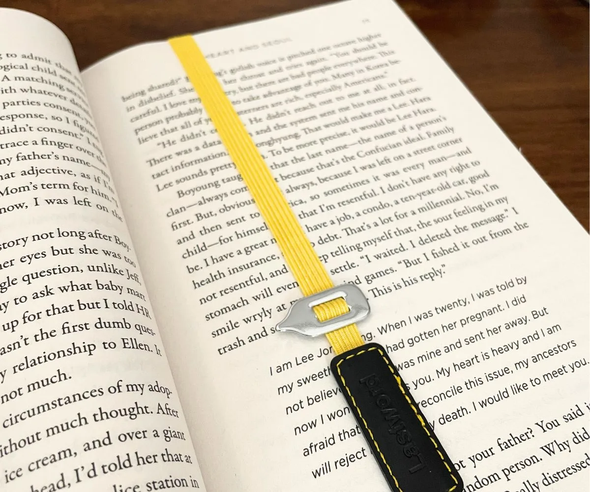last word bookmark in book on dark table