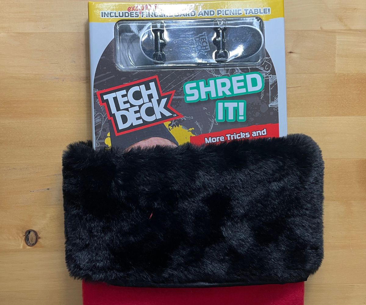 Tech Deck Shred It! Pack with guidebook, fingerboard, and picnic table inside stocking