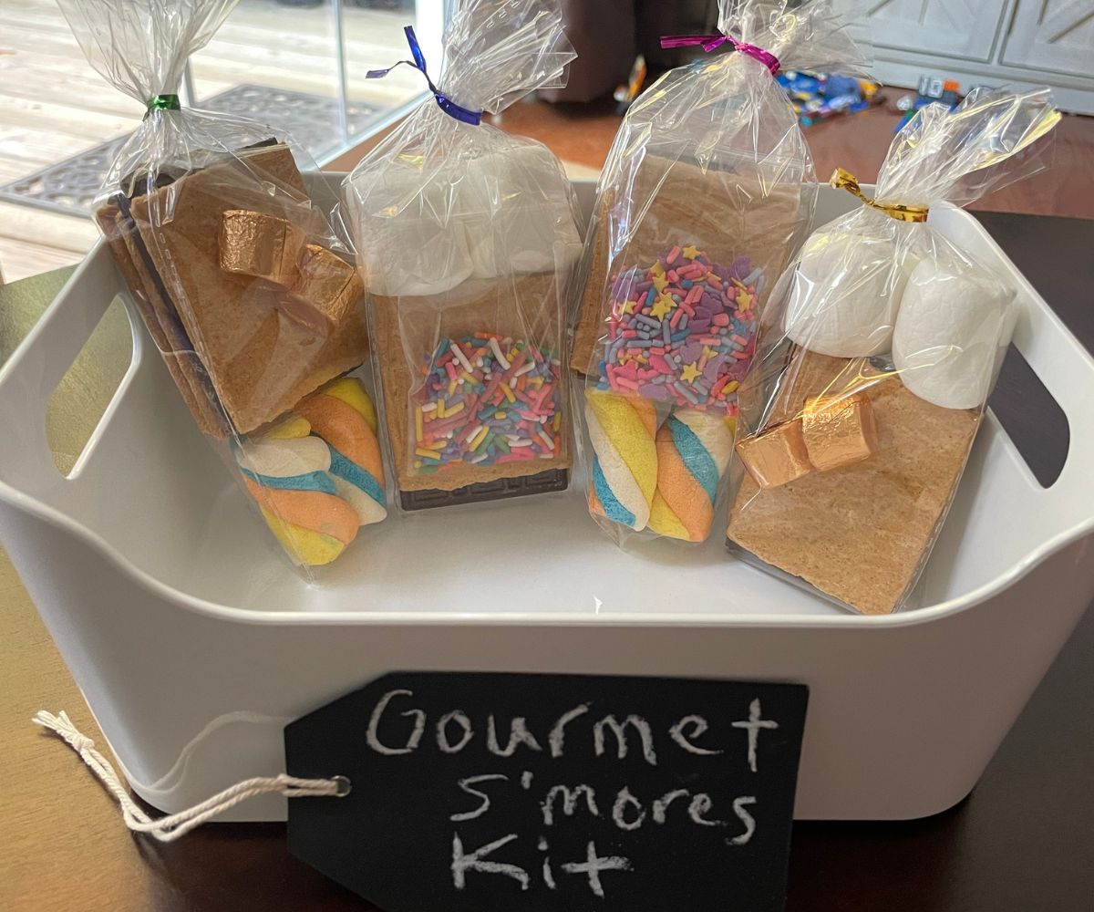 white container full of gourmet s'mores kits on table to be sold