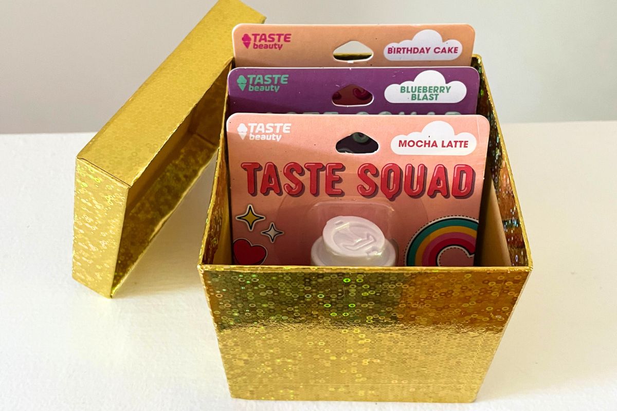 gold dollar tree gift box filled with three cute lip glosses
