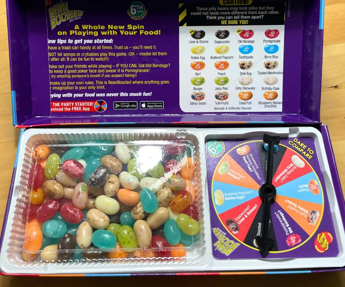 dark purple box with colorful jelly beans and spinner on right side