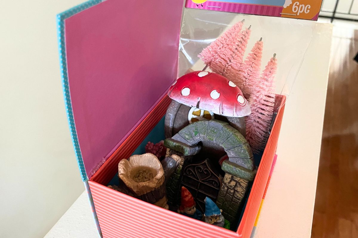 rainbow box filled with gnomes and gnome garden accessories