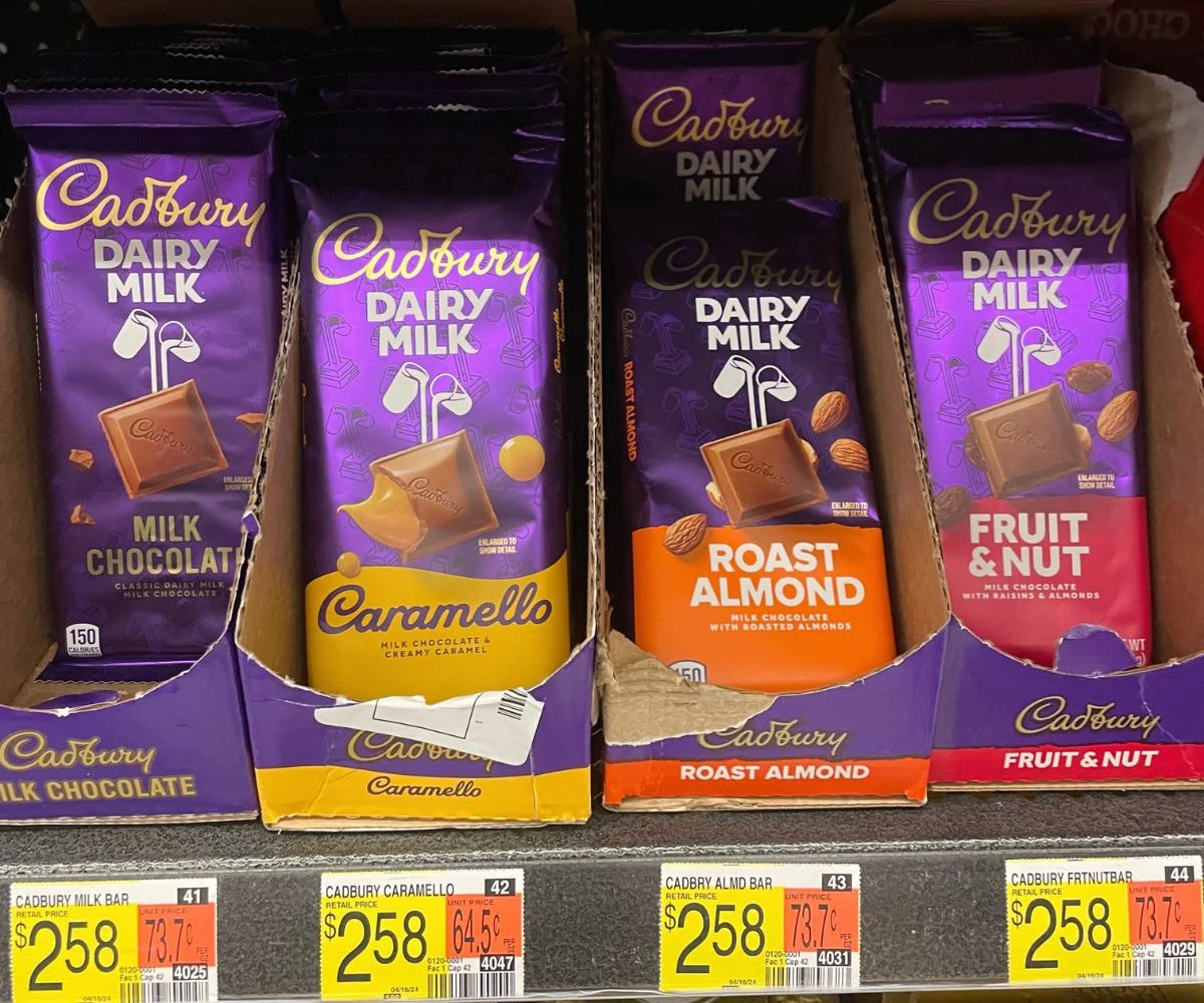 bright purple packages of four Cadbury bars on Walmart store shelf