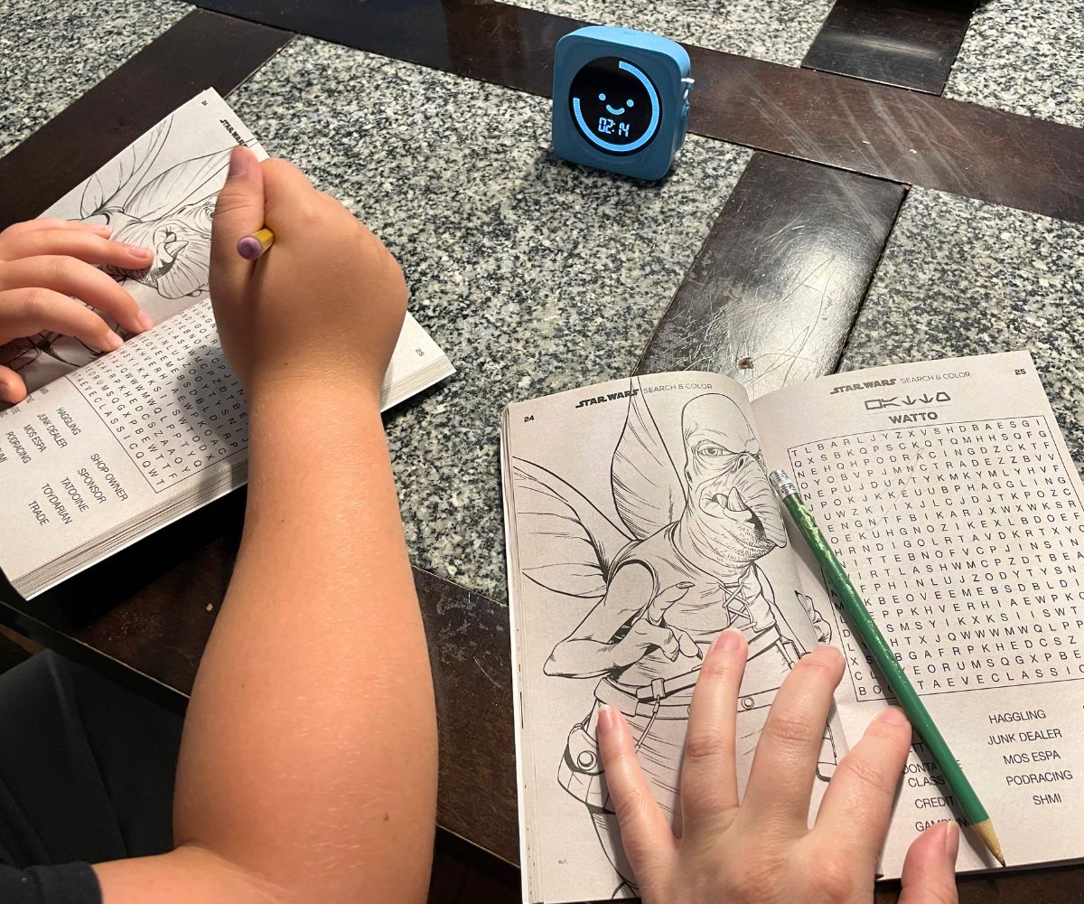 tween and mother playing Word Search competition with Star Wars word searches and light blue timer