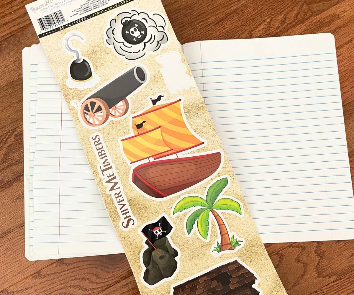 notebook opened with pirate stickers set on top
