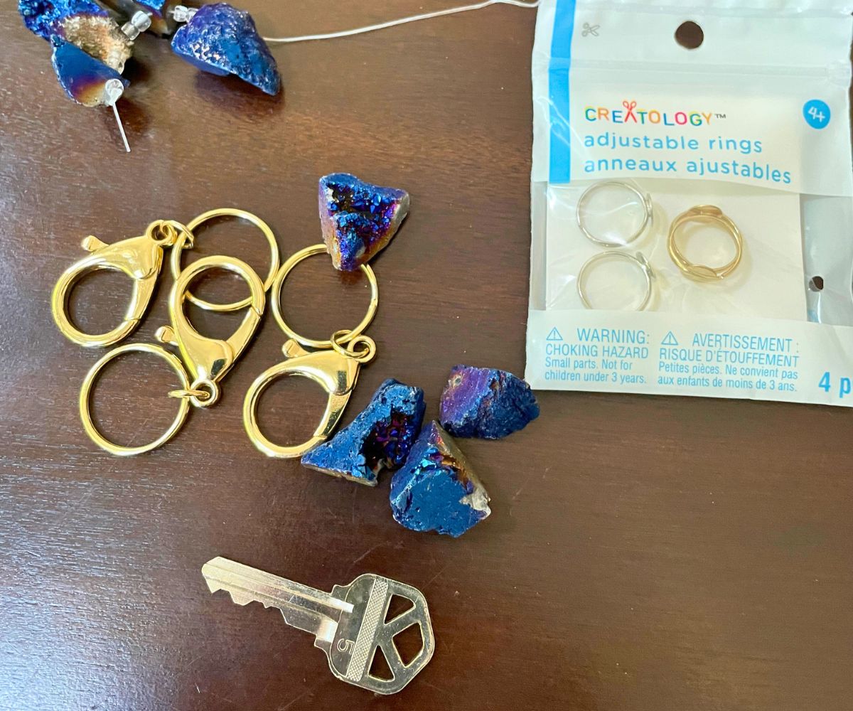 house key, lobster clasp keyrings, adjust rings with platform on top, and blue gemstones