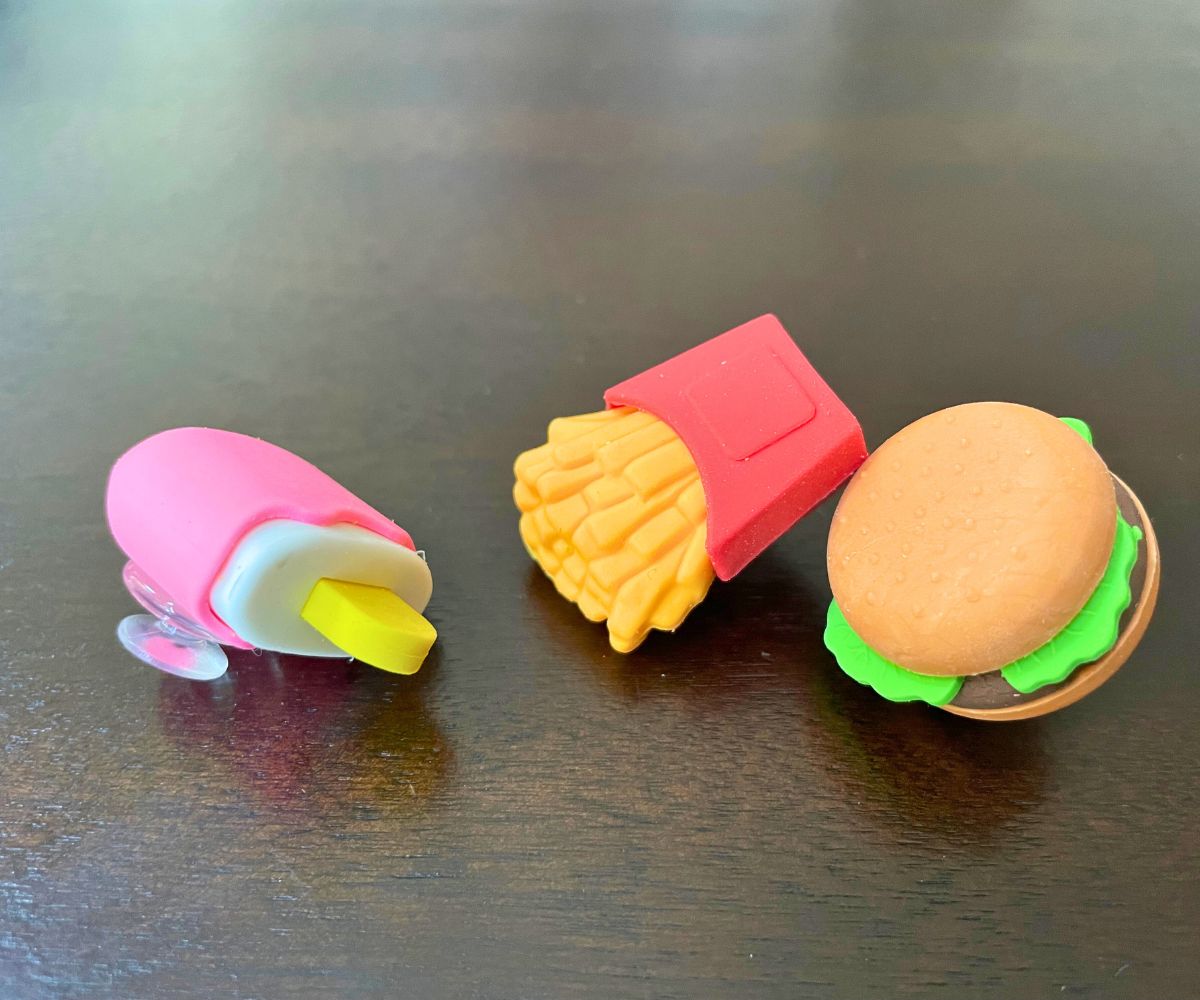 three shoe charms with mini erasers glued on