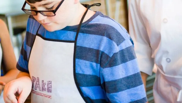 tween boy baking sweets for kids to make and sell at market day