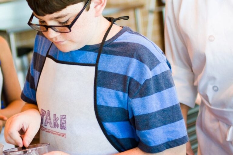 tween boy baking sweets for kids to make and sell at market day