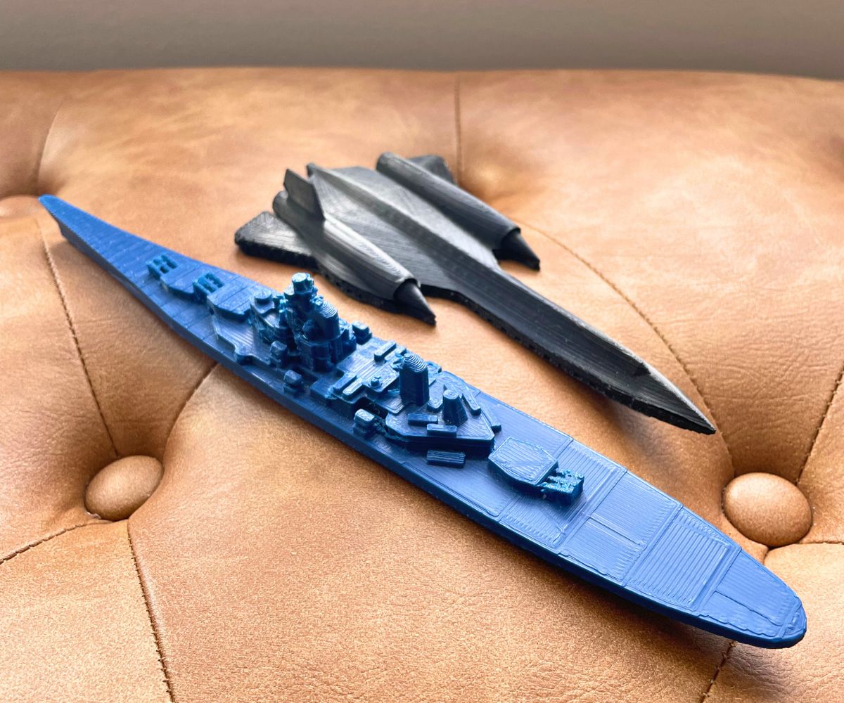 two large 3D prints - one a submarine and one a fighter jet
