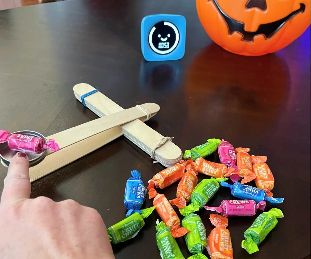 someone with candy in the catapult, playing the game