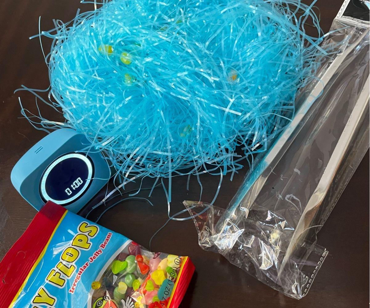 same scene, but the bright blue Easter grass has jelly beans buried in it
