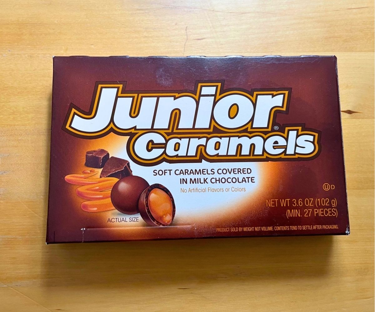 Junior Caramels box on a light wooden table