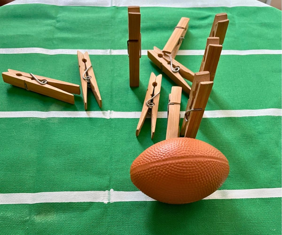 Fun super bowl home games for kids with mini toy football pushing down clothespins