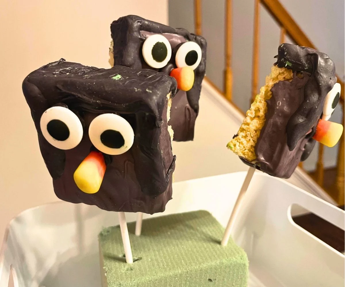 three owl krispies pop treats standing up in white tray