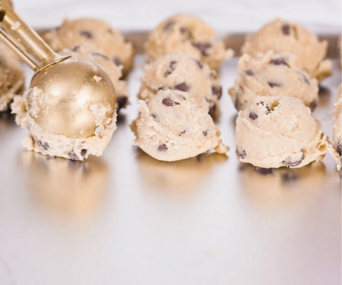 cookie dough sheet filled with little scoops of homemade cookie dough to freeze
