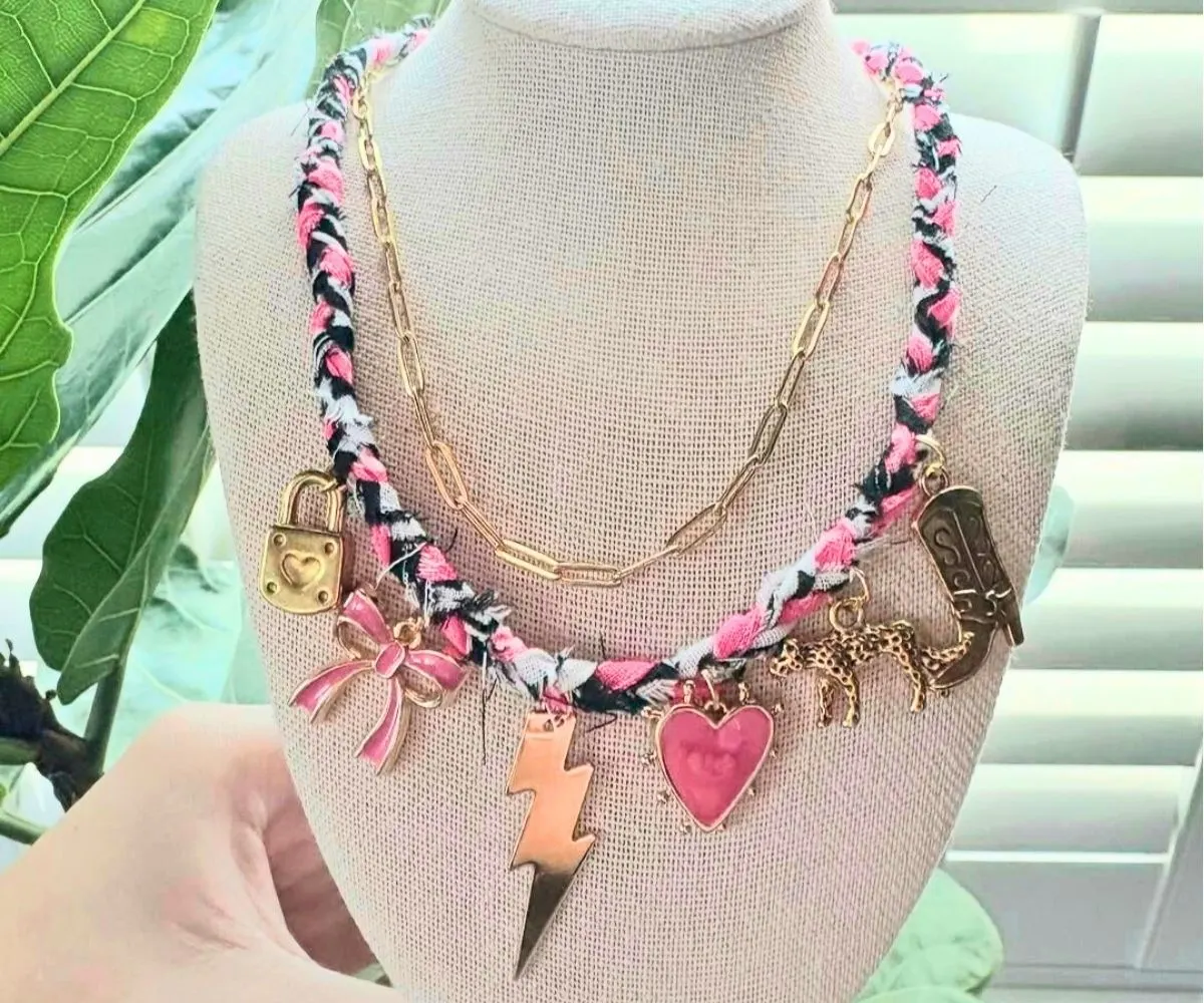 Ava displaying her homemade necklaces