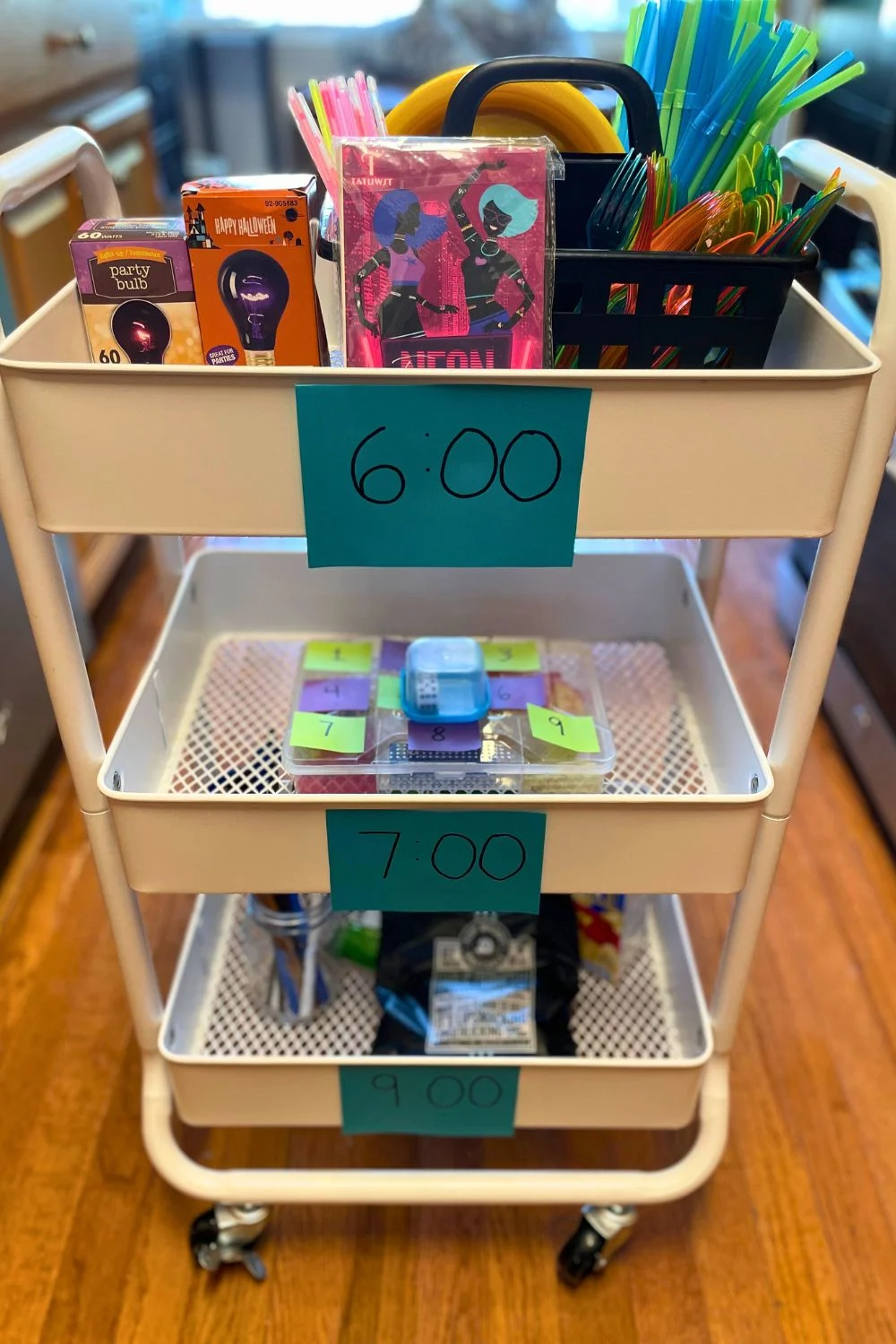 three tier cart with times on each tier filled with fun food experiences