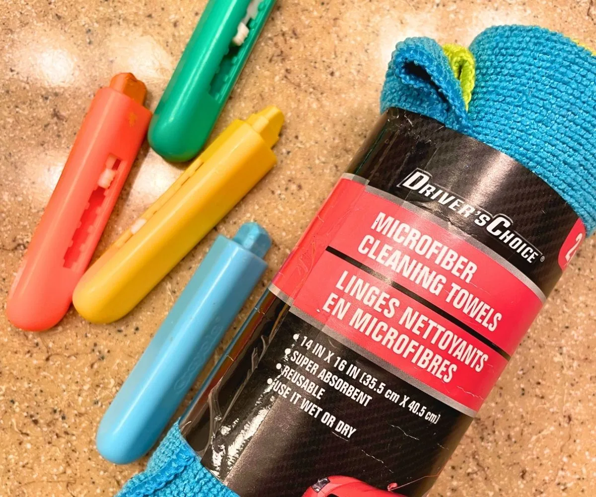 package of micro clothes and four different colored soap crayons on vanity