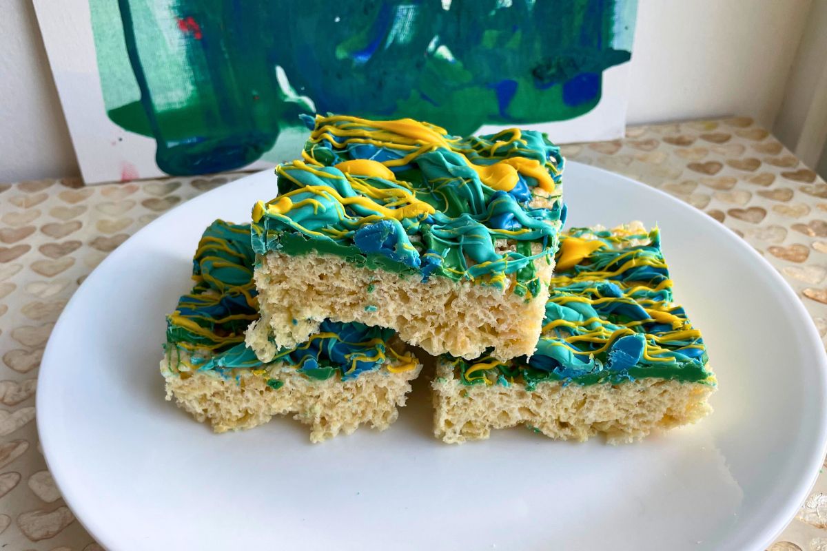 plate of three, candy-melt, graffiti-covered Rice Krispies treats