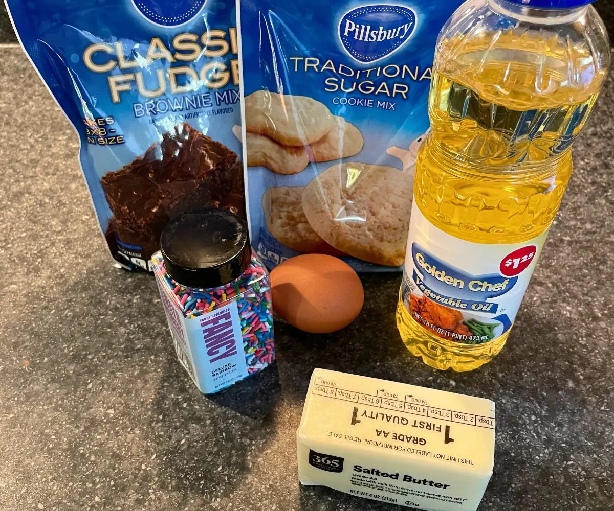 package of brownie mix, cookie mix, vegetable oil, rainbow sprinkles, egg, and butter