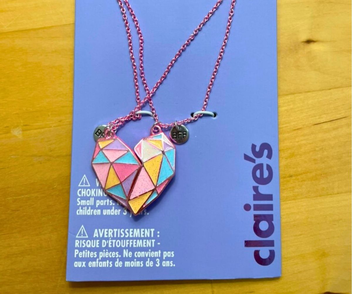 pretty geometric patterned best friend necklace on wooden table