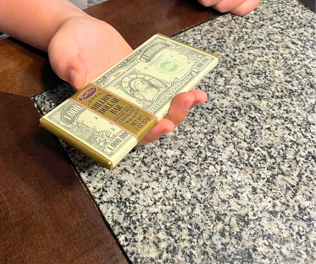 tween holding a million dollar chocolate bar
