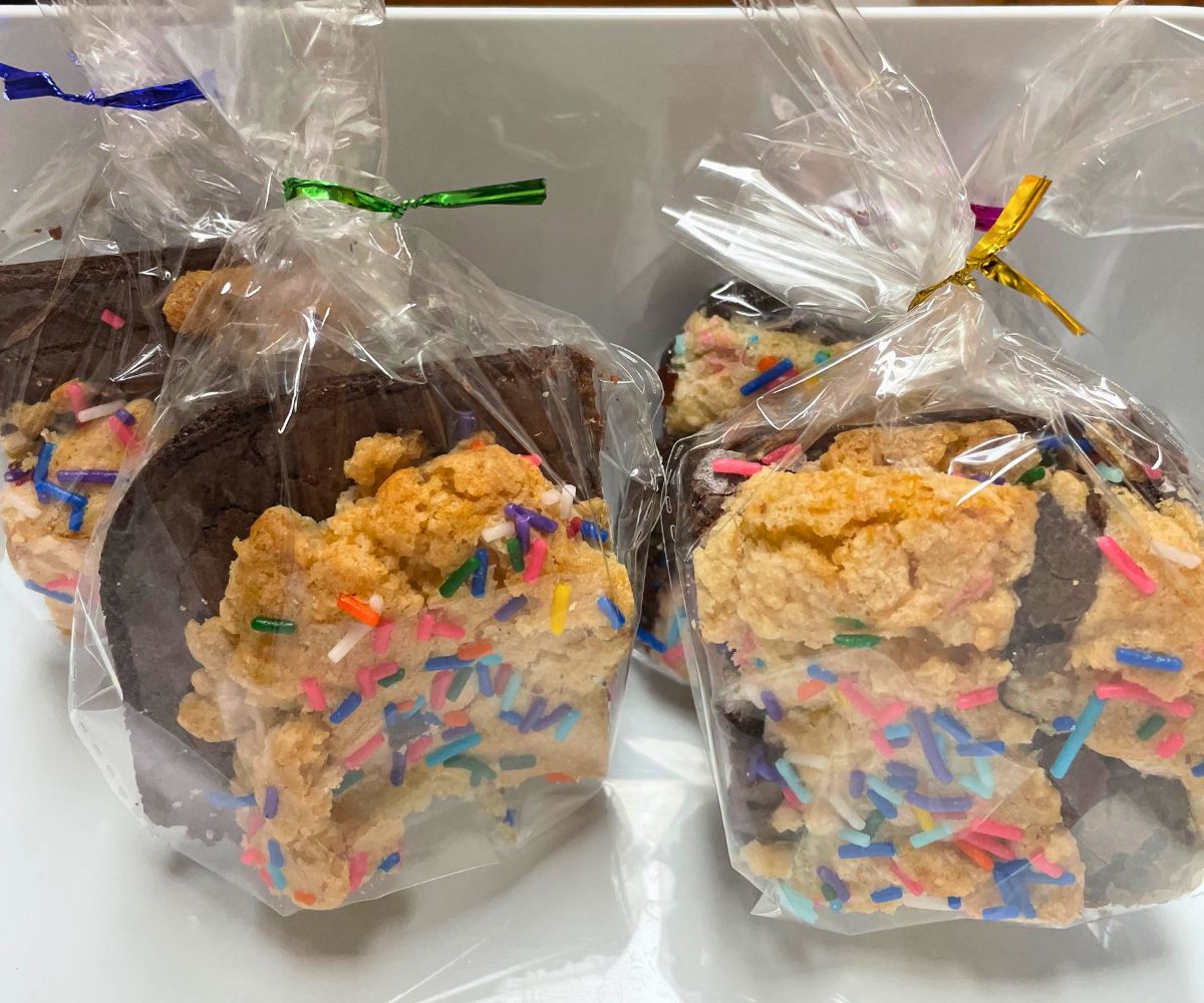 packaged brookies in white container with rainbow sprinkles on top