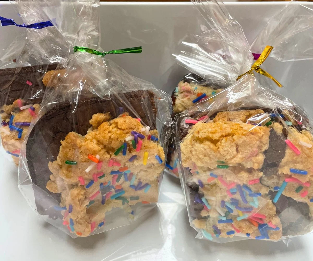 packaged brookies in white container with rainbow sprinkles on top