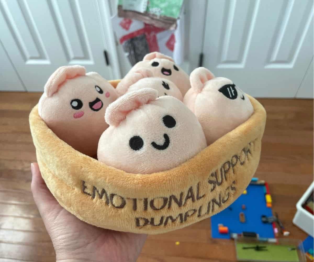 tan squishy emotional support dumplings sitting in a velvety container