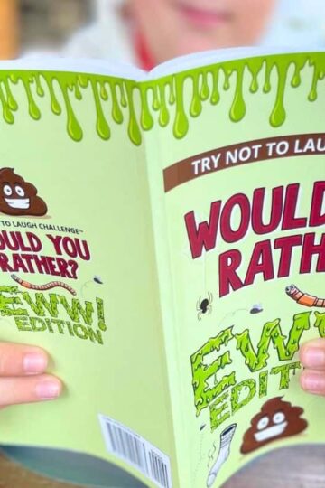 tween boy reading Would You Rather Ewww Edition book as Christmas gift