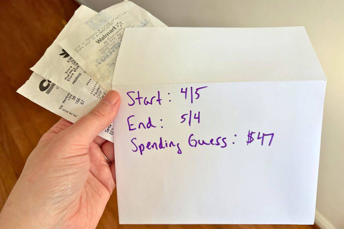 woman holding envelope and receipts with dates on the outside of it and estimated $47 in spending