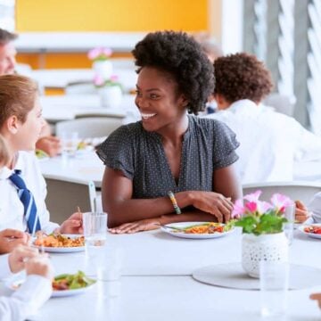 principal eating lunch with a classroom of students
