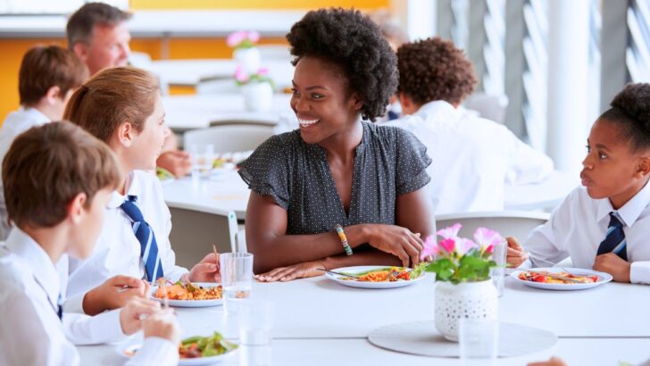 principal eating lunch with a classroom of students