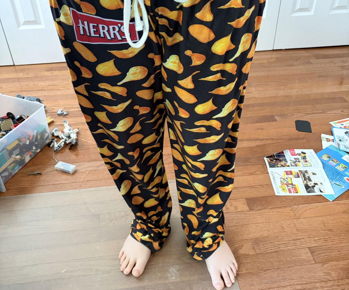 preteen boy wearing a fun pair of Herr's potato chip pajama pants