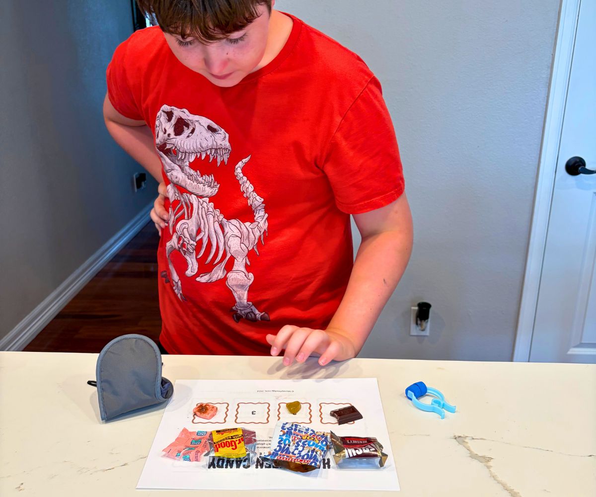 child looking at the answers afterwards with blindfold off, smiling