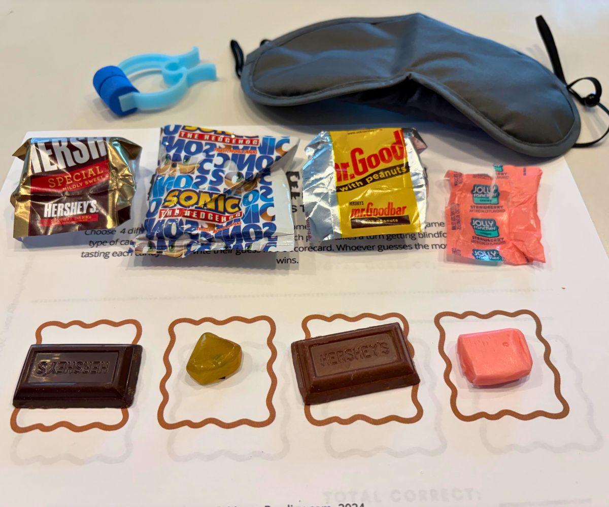 Halloween candy experiment blind taste test printable with blindfold, nose pincher, and four different varieties of candies with their wrappers unwrapped